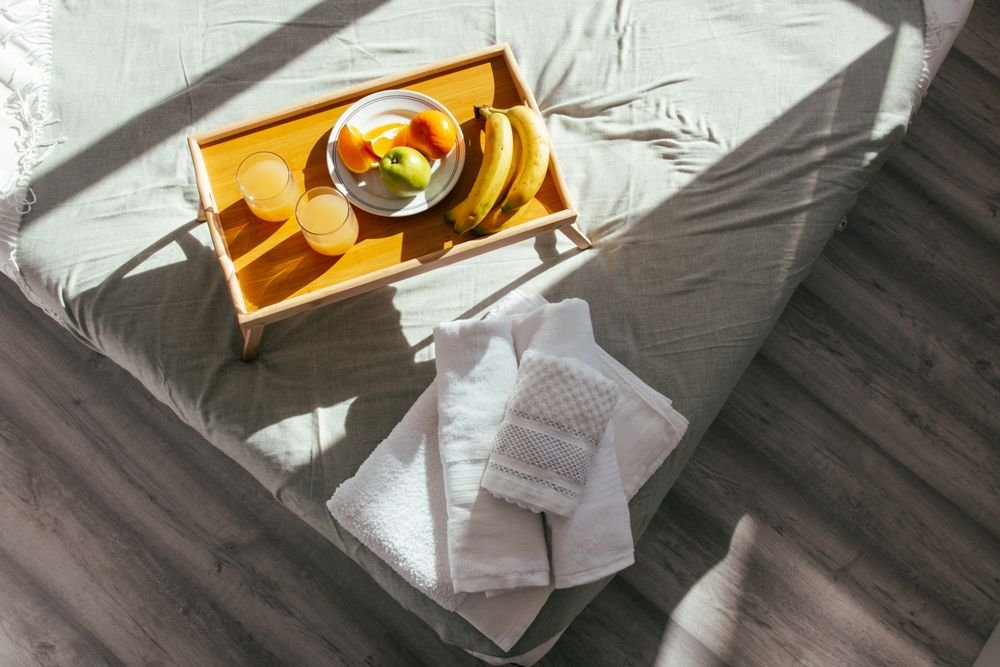 Guest-ready bed with fresh towels